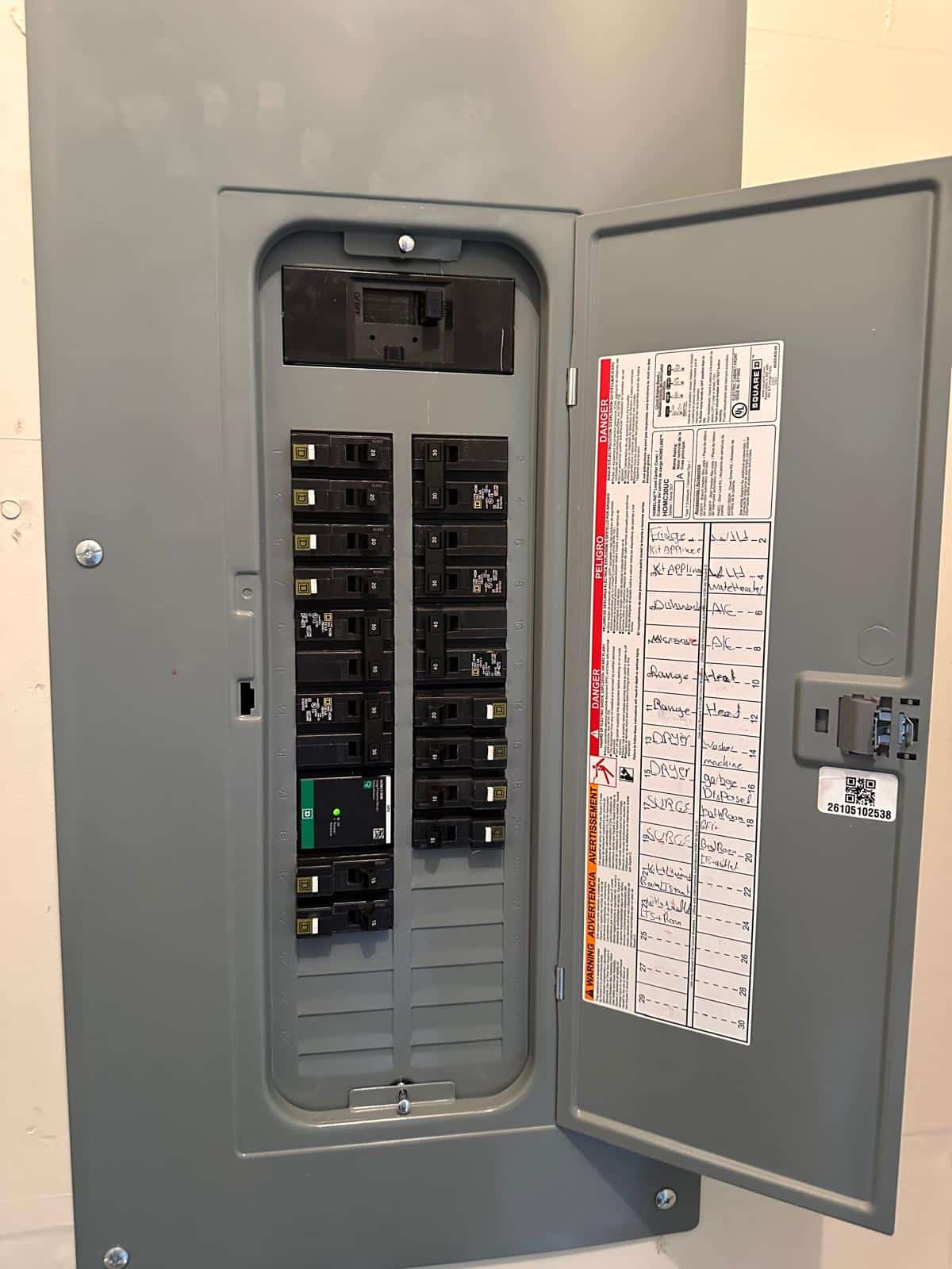 New Square D Homeline panel with surge protector and typed circuit directory — after upgrade