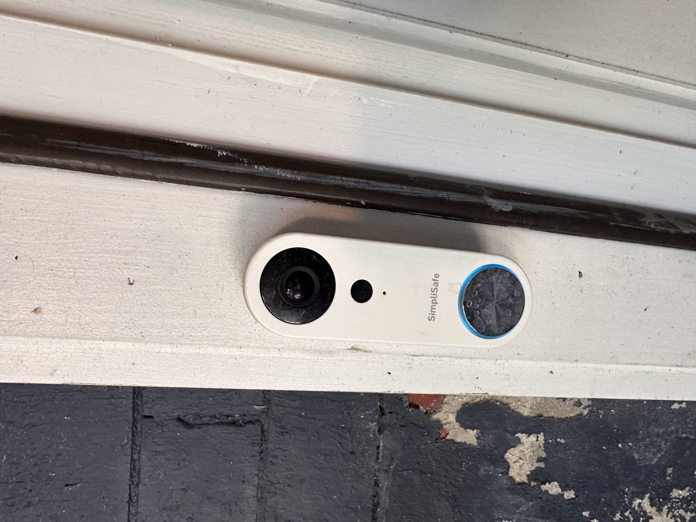 Video doorbell installed and wired into the door trim of a Fairfax home